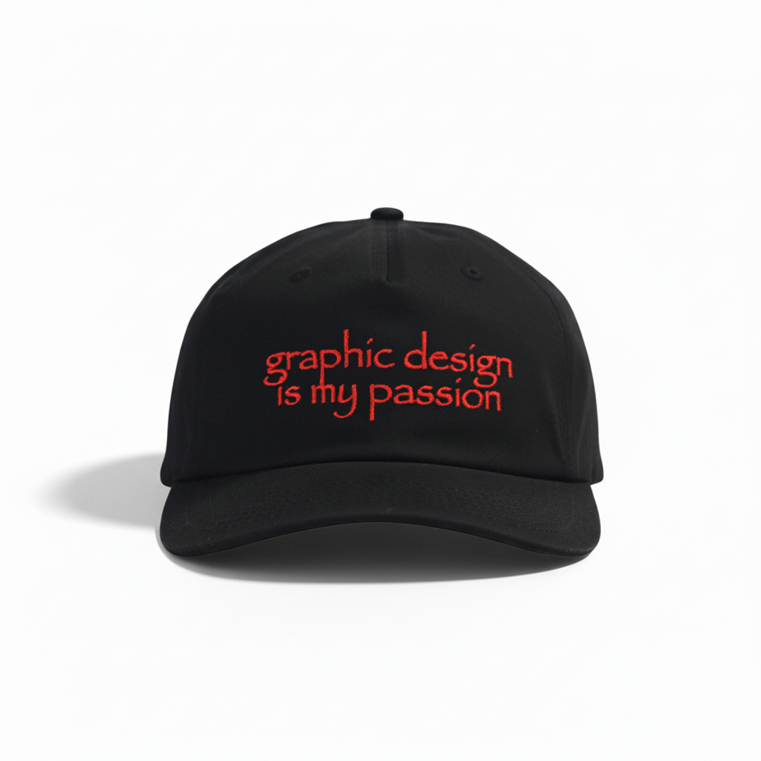 Black cap with red text 'graphic design is my passion' on a white background